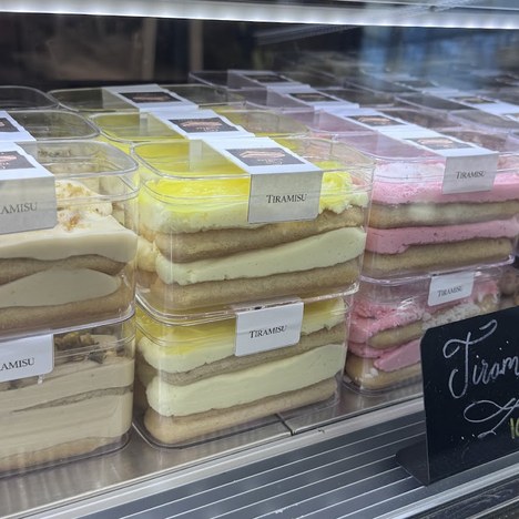 Case of packaged tiramisu in classic, lemon and strawberry flavors